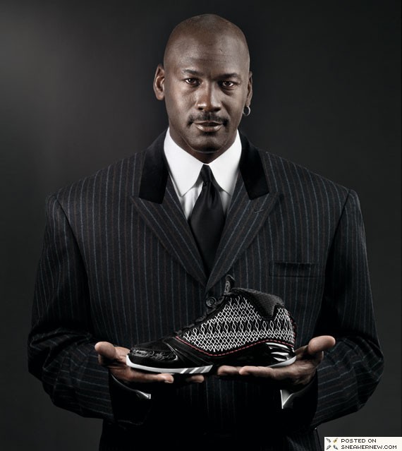 Michael Jordan holding Air Jordan XX3
