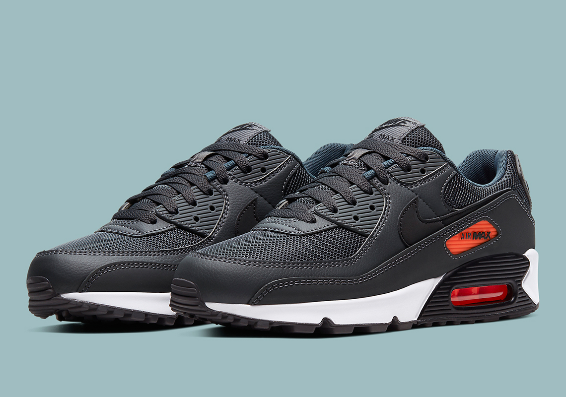 The Nike Air Max 90 Premium Utilizes Grey Leathers With Bright Orange Accents